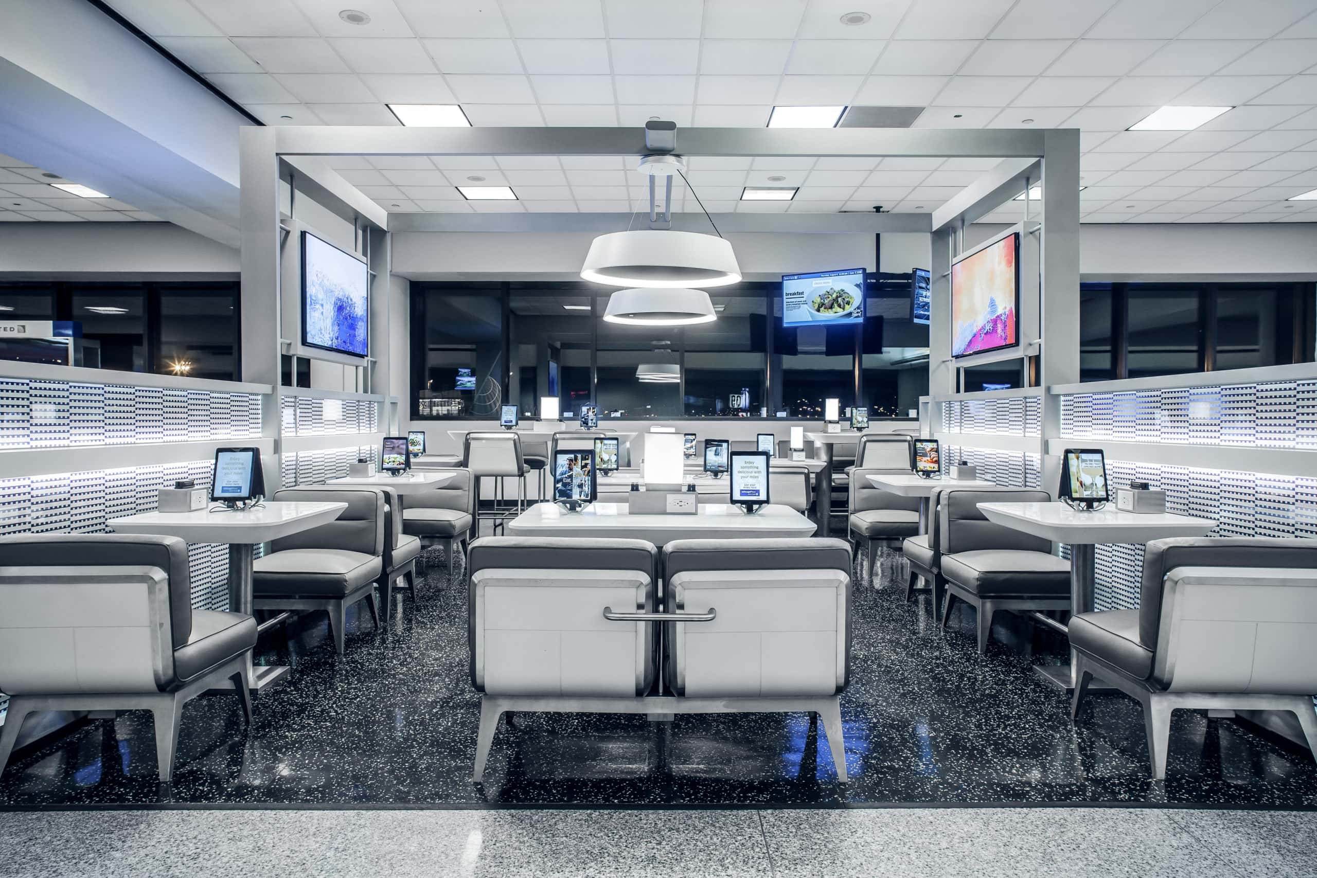 iPads are fixed to tables and counters in Gate Lounges at Newark and Houston airport. Image: OTG