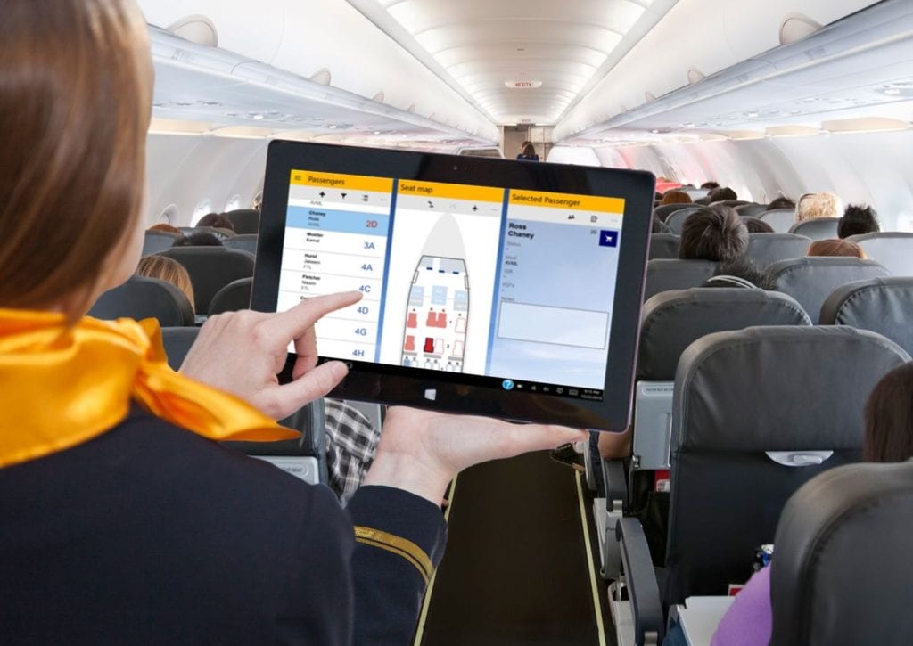 Crew member with tablet using mCabin