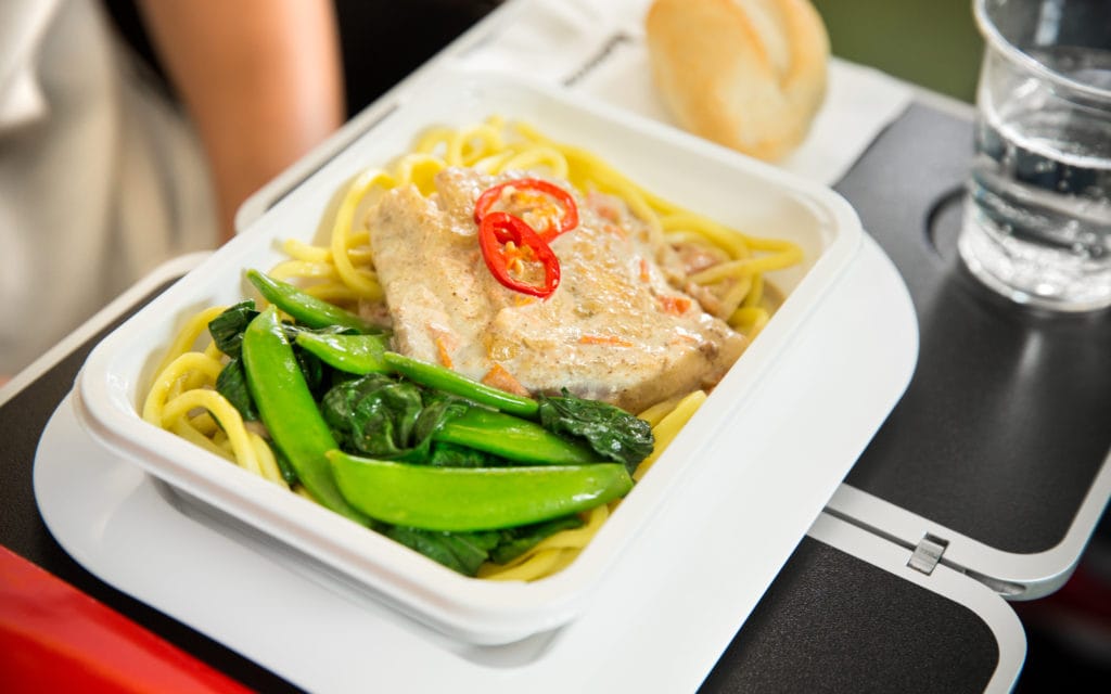 Qantas' Barramundi: poached in a lightly-spiced coconut sauce with noodles, sugar snaps, choy-sum, and chilli. 