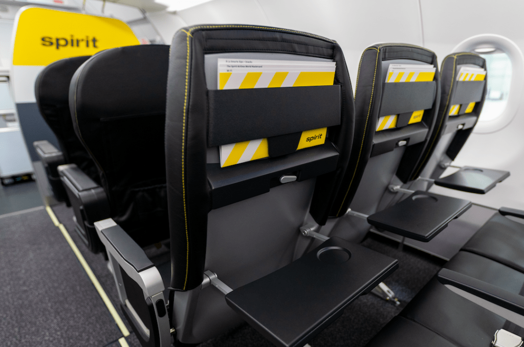 Spirit Airlines' new cabin interior features an on-brand black and yellow collar palette